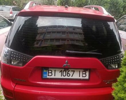 Красный Мицубиси Аутлендер ХЛ, объемом двигателя 2.4 л и пробегом 306 тыс. км за 10000 $, фото 7 на Automoto.ua