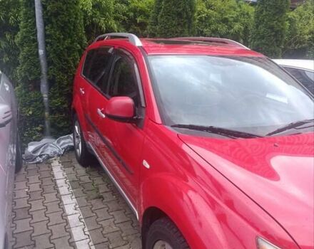 Красный Мицубиси Аутлендер ХЛ, объемом двигателя 2.4 л и пробегом 306 тыс. км за 10000 $, фото 3 на Automoto.ua