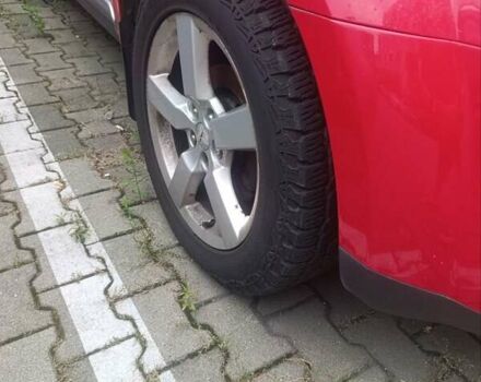 Красный Мицубиси Аутлендер ХЛ, объемом двигателя 2.4 л и пробегом 306 тыс. км за 10000 $, фото 6 на Automoto.ua