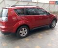 Красный Мицубиси Аутлендер ХЛ, объемом двигателя 2.4 л и пробегом 302 тыс. км за 8900 $, фото 4 на Automoto.ua