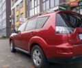 Красный Мицубиси Аутлендер ХЛ, объемом двигателя 2.4 л и пробегом 302 тыс. км за 8900 $, фото 5 на Automoto.ua
