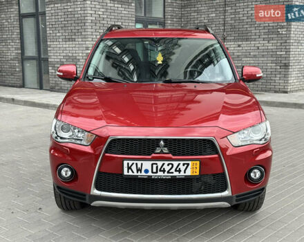 Красный Мицубиси Аутлендер ХЛ, объемом двигателя 2.2 л и пробегом 188 тыс. км за 10550 $, фото 1 на Automoto.ua