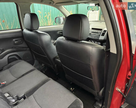 Красный Мицубиси Аутлендер ХЛ, объемом двигателя 2.2 л и пробегом 227 тыс. км за 11999 $, фото 46 на Automoto.ua