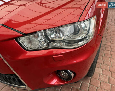 Красный Мицубиси Аутлендер ХЛ, объемом двигателя 2.2 л и пробегом 227 тыс. км за 11999 $, фото 10 на Automoto.ua