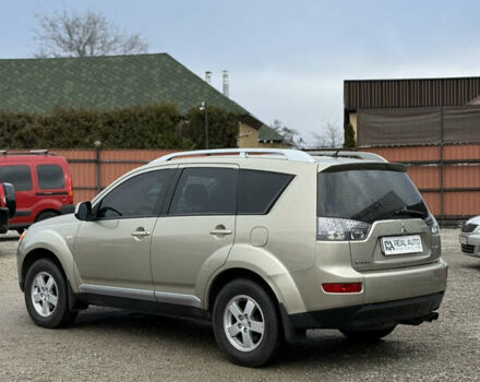 Желтый Мицубиси Аутлендер ХЛ, объемом двигателя 1.97 л и пробегом 204 тыс. км за 8400 $, фото 2 на Automoto.ua