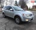 Серый Мицубиси Аутлендер ХЛ, объемом двигателя 2.4 л и пробегом 307 тыс. км за 8299 $, фото 1 на Automoto.ua