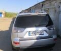 Серый Мицубиси Аутлендер ХЛ, объемом двигателя 3 л и пробегом 240 тыс. км за 9000 $, фото 1 на Automoto.ua