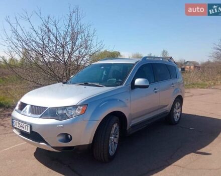 Серый Мицубиси Аутлендер ХЛ, объемом двигателя 2.4 л и пробегом 188 тыс. км за 9200 $, фото 1 на Automoto.ua