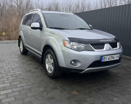 Серый Мицубиси Аутлендер ХЛ, объемом двигателя 2.36 л и пробегом 241 тыс. км за 8200 $, фото 1 на Automoto.ua
