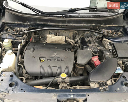 Синий Мицубиси Аутлендер ХЛ, объемом двигателя 2.4 л и пробегом 295 тыс. км за 7600 $, фото 6 на Automoto.ua