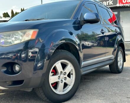 Синий Мицубиси Аутлендер ХЛ, объемом двигателя 2.4 л и пробегом 215 тыс. км за 9290 $, фото 2 на Automoto.ua