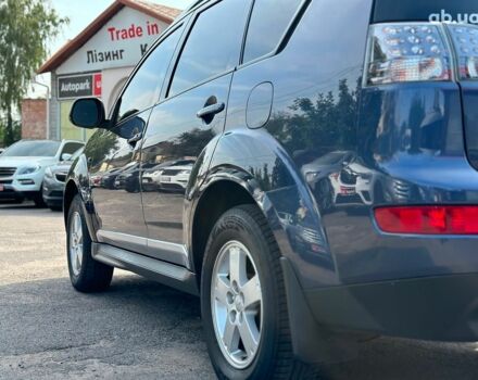 Синий Мицубиси Аутлендер ХЛ, объемом двигателя 2.4 л и пробегом 215 тыс. км за 9290 $, фото 10 на Automoto.ua