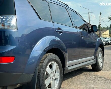 Синий Мицубиси Аутлендер ХЛ, объемом двигателя 2.4 л и пробегом 215 тыс. км за 9290 $, фото 7 на Automoto.ua