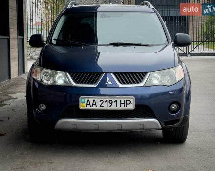 Синий Мицубиси Аутлендер ХЛ, объемом двигателя 2.4 л и пробегом 249 тыс. км за 8800 $, фото 1 на Automoto.ua