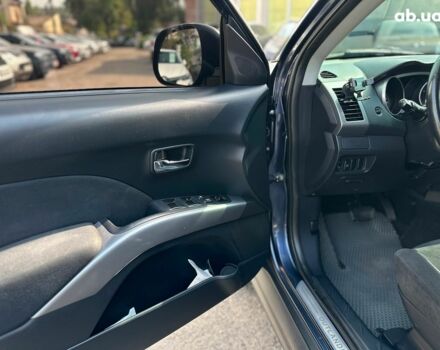 Синий Мицубиси Аутлендер ХЛ, объемом двигателя 2.4 л и пробегом 215 тыс. км за 9290 $, фото 22 на Automoto.ua