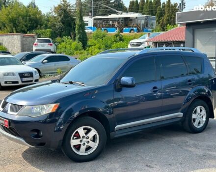 Синий Мицубиси Аутлендер ХЛ, объемом двигателя 2.4 л и пробегом 215 тыс. км за 9290 $, фото 1 на Automoto.ua
