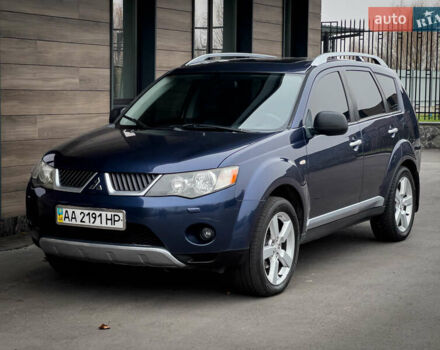 Синий Мицубиси Аутлендер ХЛ, объемом двигателя 2.4 л и пробегом 249 тыс. км за 8800 $, фото 1 на Automoto.ua