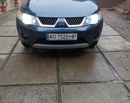 Синий Мицубиси Аутлендер ХЛ, объемом двигателя 2.4 л и пробегом 240 тыс. км за 8500 $, фото 1 на Automoto.ua