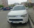 Белый Мицубиси Аутлендер, объемом двигателя 2.4 л и пробегом 130 тыс. км за 13000 $, фото 1 на Automoto.ua