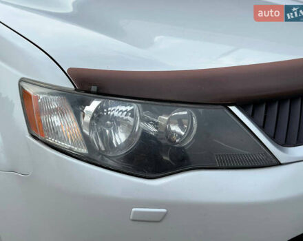 Белый Мицубиси Аутлендер, объемом двигателя 2.36 л и пробегом 160 тыс. км за 9299 $, фото 42 на Automoto.ua