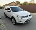 Белый Мицубиси Аутлендер, объемом двигателя 2.36 л и пробегом 213 тыс. км за 7500 $, фото 1 на Automoto.ua