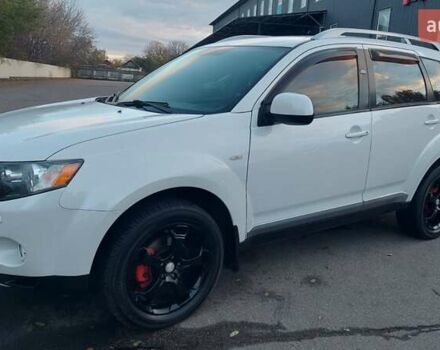 Белый Мицубиси Аутлендер, объемом двигателя 2.36 л и пробегом 185 тыс. км за 8950 $, фото 2 на Automoto.ua