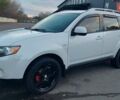 Белый Мицубиси Аутлендер, объемом двигателя 2.36 л и пробегом 185 тыс. км за 8950 $, фото 2 на Automoto.ua