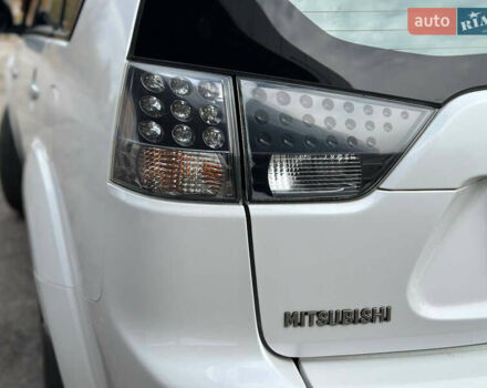 Белый Мицубиси Аутлендер, объемом двигателя 2.36 л и пробегом 160 тыс. км за 9299 $, фото 45 на Automoto.ua