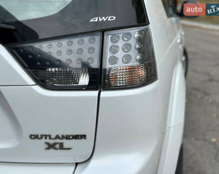 Белый Мицубиси Аутлендер, объемом двигателя 2.36 л и пробегом 160 тыс. км за 9299 $, фото 44 на Automoto.ua