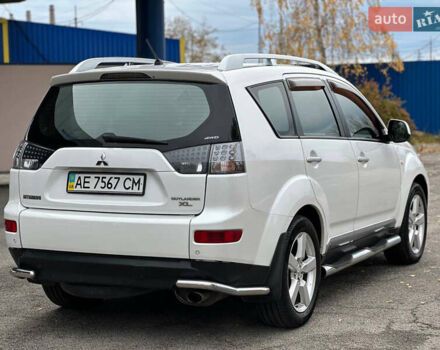 Белый Мицубиси Аутлендер, объемом двигателя 2.36 л и пробегом 160 тыс. км за 9299 $, фото 5 на Automoto.ua