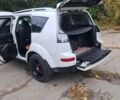 Білий Міцубісі Аутлендер, об'ємом двигуна 2.36 л та пробігом 185 тис. км за 9000 $, фото 2 на Automoto.ua