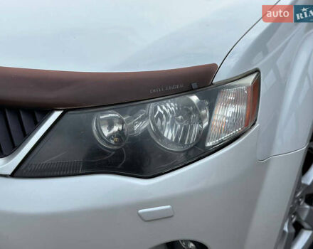 Белый Мицубиси Аутлендер, объемом двигателя 2.36 л и пробегом 160 тыс. км за 9299 $, фото 43 на Automoto.ua