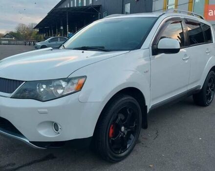 Белый Мицубиси Аутлендер, объемом двигателя 2.36 л и пробегом 185 тыс. км за 8950 $, фото 1 на Automoto.ua