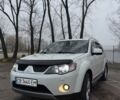 Белый Мицубиси Аутлендер, объемом двигателя 2.4 л и пробегом 329 тыс. км за 8800 $, фото 2 на Automoto.ua