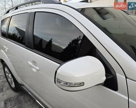 Білий Міцубісі Аутлендер, об'ємом двигуна 2.36 л та пробігом 178 тис. км за 10200 $, фото 51 на Automoto.ua