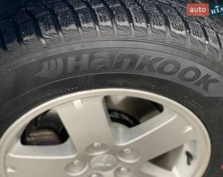 Білий Міцубісі Аутлендер, об'ємом двигуна 2 л та пробігом 248 тис. км за 10490 $, фото 3 на Automoto.ua