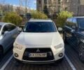 Белый Мицубиси Аутлендер, объемом двигателя 2.4 л и пробегом 154 тыс. км за 12500 $, фото 1 на Automoto.ua