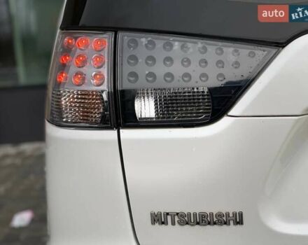 Білий Міцубісі Аутлендер, об'ємом двигуна 2 л та пробігом 248 тис. км за 10490 $, фото 12 на Automoto.ua
