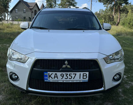 Белый Мицубиси Аутлендер, объемом двигателя 2.4 л и пробегом 170 тыс. км за 14500 $, фото 1 на Automoto.ua