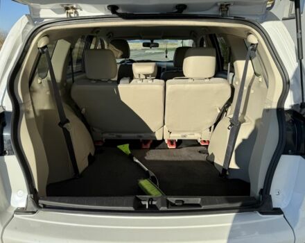 Белый Мицубиси Аутлендер, объемом двигателя 2.4 л и пробегом 223 тыс. км за 10500 $, фото 3 на Automoto.ua