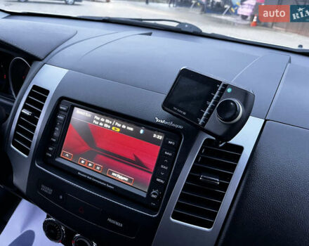 Белый Мицубиси Аутлендер, объемом двигателя 2.3 л и пробегом 161 тыс. км за 11150 $, фото 47 на Automoto.ua