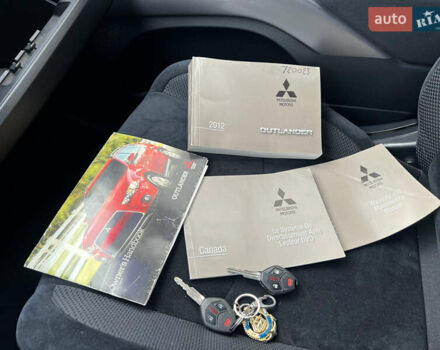 Білий Міцубісі Аутлендер, об'ємом двигуна 2.36 л та пробігом 260 тис. км за 9700 $, фото 28 на Automoto.ua