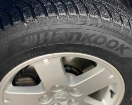 Белый Мицубиси Аутлендер, объемом двигателя 2 л и пробегом 248 тыс. км за 10490 $, фото 1 на Automoto.ua