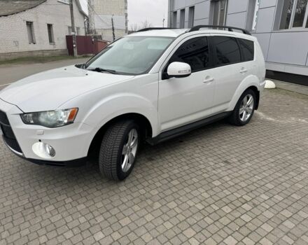 Білий Міцубісі Аутлендер, об'ємом двигуна 2.4 л та пробігом 174 тис. км за 12500 $, фото 1 на Automoto.ua