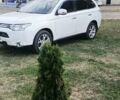 Белый Мицубиси Аутлендер, объемом двигателя 2.36 л и пробегом 299 тыс. км за 13000 $, фото 1 на Automoto.ua