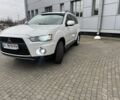 Білий Міцубісі Аутлендер, об'ємом двигуна 2.4 л та пробігом 174 тис. км за 12500 $, фото 1 на Automoto.ua