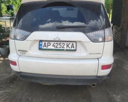 Белый Мицубиси Аутлендер, объемом двигателя 2.36 л и пробегом 113 тыс. км за 12500 $, фото 1 на Automoto.ua