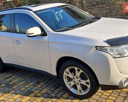 Белый Мицубиси Аутлендер, объемом двигателя 2.36 л и пробегом 240 тыс. км за 11800 $, фото 2 на Automoto.ua