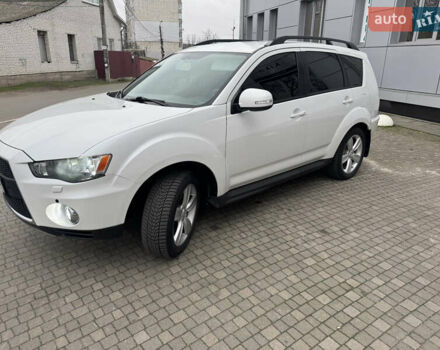 Белый Мицубиси Аутлендер, объемом двигателя 2.4 л и пробегом 180 тыс. км за 12500 $, фото 1 на Automoto.ua