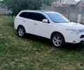 Белый Мицубиси Аутлендер, объемом двигателя 2.4 л и пробегом 300 тыс. км за 12500 $, фото 1 на Automoto.ua